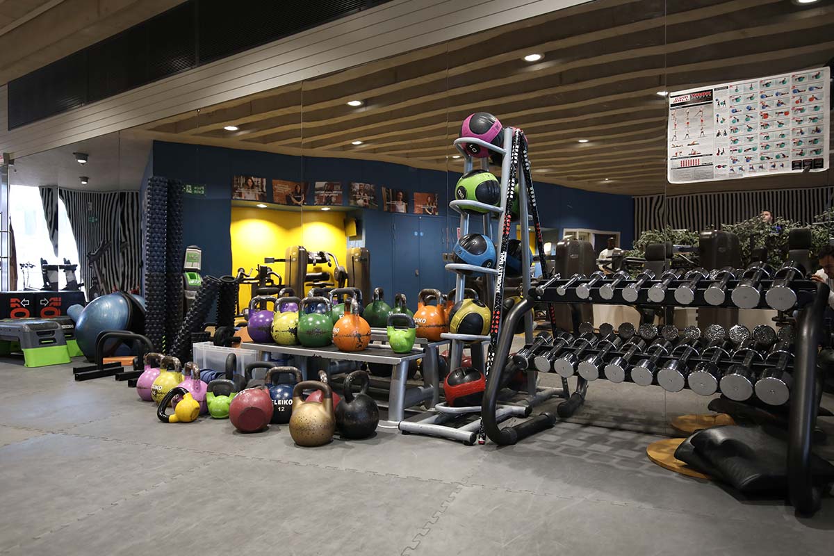 A photograph of different dumbbells and weights